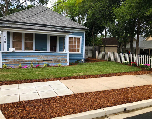 New sod install with bark and plants planted for a fresh new look